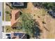 Aerial view showing house and large lot with solar panels at 733 Cherry Laurel St, Minneola, FL 34715