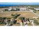 Aerial view of residential area near lake and businesses at 733 Cherry Laurel St, Minneola, FL 34715