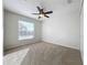 Well-lit bedroom featuring neutral decor, a ceiling fan, and ample natural light at 733 Cherry Laurel St, Minneola, FL 34715