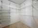 Spacious walk-in closet with wire shelving and baskets at 733 Cherry Laurel St, Minneola, FL 34715