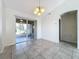 Dining area with tile floors, chandelier and access to a screened porch at 733 Cherry Laurel St, Minneola, FL 34715