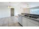 Bright dining area with tile floors and access to a screened porch at 733 Cherry Laurel St, Minneola, FL 34715