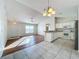 Open concept dining area with hardwood floors and kitchen access at 733 Cherry Laurel St, Minneola, FL 34715