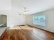 Living room with hardwood floors and a door to outside at 733 Cherry Laurel St, Minneola, FL 34715