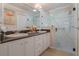 Elegant bathroom with double vanity, granite countertop, and glass shower at 7592 Se 170Th Longview Ln, The Villages, FL 32162