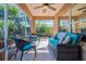 Relaxing screened patio with seating area and lush landscaping at 7592 Se 170Th Longview Ln, The Villages, FL 32162