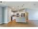 Modern kitchen with white cabinets and granite countertops at 8 Dogwood Circle Pl, Ocala, FL 34472