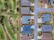 Aerial view of the house showcasing its location on a golf course and the neighborhood at 802 Nancy Dr, The Villages, FL 32163