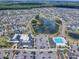 Aerial view showcases the Ezell Regional Recreation Center, pool, and community amidst the residential neighborhood at 802 Nancy Dr, The Villages, FL 32163