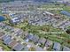 Aerial view showcasing The Market at Sawgrass Grove, Clifton Cove Putting Course, and Ezell Regional Recreation Center at 802 Nancy Dr, The Villages, FL 32163