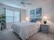 Comfortable bedroom with a queen bed, soft lighting, and a serene atmosphere for relaxation and rest at 802 Nancy Dr, The Villages, FL 32163