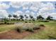 The golf course has beautiful cloudscape views, lush tropical palm trees, and unique native plantings at 802 Nancy Dr, The Villages, FL 32163