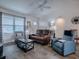 Cozy living room with comfortable seating, neutral walls, and ample natural light creating a warm atmosphere at 802 Nancy Dr, The Villages, FL 32163