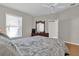 Bedroom with wood floors and a ceiling fan at 814 Hilda Way, The Villages, FL 32162