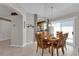 Dining room with wood table and access to kitchen at 814 Hilda Way, The Villages, FL 32162