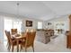 Bright dining room with wood table and chairs at 814 Hilda Way, The Villages, FL 32162