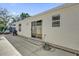 House exterior showing sliding glass door to backyard at 814 Hilda Way, The Villages, FL 32162