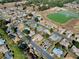 Aerial view of Spruce Creek Country Club community, showcasing homes and a lake at 8460 Se 137Th Loop, Summerfield, FL 34491