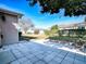 Private backyard with grassy area and stone retaining wall at 8460 Se 137Th Loop, Summerfield, FL 34491