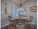 Charming dining area with wicker chairs and a glass-top table at 8460 Se 137Th Loop, Summerfield, FL 34491