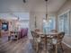 Bright dining area with a glass-top table and wicker chairs at 8460 Se 137Th Loop, Summerfield, FL 34491