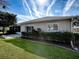 Well-maintained house exterior with manicured landscaping at 8460 Se 137Th Loop, Summerfield, FL 34491