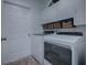 Bright laundry room with washer, dryer, and ample storage at 8460 Se 137Th Loop, Summerfield, FL 34491