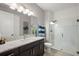 Bathroom with shower, vanity, and toilet at 8493 Hartford Way, Mount Dora, FL 32757