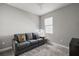 Bedroom with sofa and window at 8493 Hartford Way, Mount Dora, FL 32757