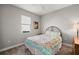 Cozy bedroom with a queen-size bed and window at 8493 Hartford Way, Mount Dora, FL 32757