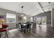 Bright dining area with a glass table and black leather chairs at 8493 Hartford Way, Mount Dora, FL 32757