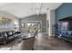 Relaxing living room with a leather sofa and view of the backyard at 8493 Hartford Way, Mount Dora, FL 32757