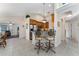 Kitchen featuring stainless steel appliances, breakfast bar seating, and an archway to the living room at 85 Golfview Cir, Umatilla, FL 32784