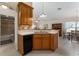 Well-designed kitchen with a dishwasher, a corner sink, and tile backsplash at 85 Golfview Cir, Umatilla, FL 32784