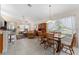 Bright living room with a large window, neutral walls, and wood-look tile flooring at 85 Golfview Cir, Umatilla, FL 32784