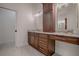 Elegant bathroom features granite vanity, large mirror, and modern fixtures at 858 Pinckney Ln, The Villages, FL 32162