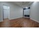 Large bedroom with hardwood floors and window with shutters at 858 Pinckney Ln, The Villages, FL 32162