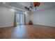 Bright bedroom with hardwood floors and French doors at 858 Pinckney Ln, The Villages, FL 32162