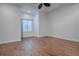 Bright bedroom with hardwood floors and a ceiling fan at 858 Pinckney Ln, The Villages, FL 32162