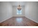 Formal dining room featuring hardwood floors and a chandelier at 858 Pinckney Ln, The Villages, FL 32162