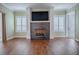 Modern fireplace with dark stone and white mantel at 858 Pinckney Ln, The Villages, FL 32162