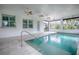 Stunning indoor pool; bright and airy with large windows and a water feature at 858 Pinckney Ln, The Villages, FL 32162