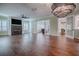 Spacious living room with fireplace, built-in entertainment center and hardwood floors at 858 Pinckney Ln, The Villages, FL 32162