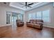 Relaxing living room with leather furniture and hardwood floors at 858 Pinckney Ln, The Villages, FL 32162