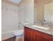 Bathroom boasts granite countertop and updated vanity at 870 Vindale Rd, Tavares, FL 32778