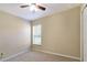 Well-lit bedroom featuring ceiling fan and window at 870 Vindale Rd, Tavares, FL 32778