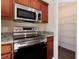 Stainless steel appliances and granite countertops in the kitchen at 870 Vindale Rd, Tavares, FL 32778