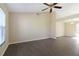 Spacious living room with dark laminate flooring and high ceilings at 870 Vindale Rd, Tavares, FL 32778