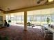 Bright and spacious screened porch with brick flooring at 917 Shorehaven Dr, Poinciana, FL 34759