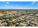 Aerial view of the property in a well-maintained neighborhood with a golf course nearby at 9184 Se 135Th St, Summerfield, FL 34491